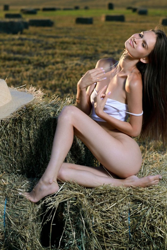 Anastasia Bella nude in a hayfield 07